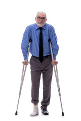 Old businessman with crutches isolated on white