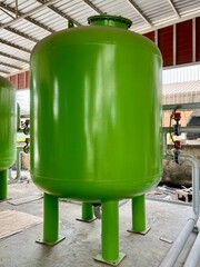 Green water tank in factory