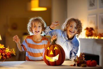 Family carving pumpkin for Halloween
