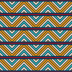 Vector decorative seamless color pattern with zigzag color stripes. Ethnic striped ornament. Simple geometric shapes pattern. Yellow, red, turquoise, beige, blue colors. Vector color background.