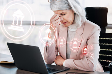 Banking, woman or headache and laptop with overlay for crisis, recession or stock market fail in office. Cryptocurrency, person and hologram with bad investment, software glitch or trading with icon