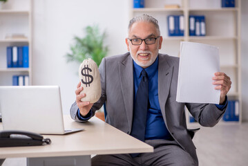 Old male employee in remuneration concept