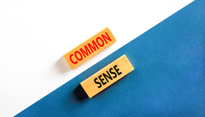 Common sense symbol. Concept words Common sense on beautiful wooden block. Beautiful white and blue...