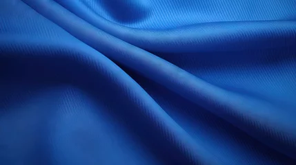 Tuinposter Close up top view of textured fabric of a blue sports jersey © vxnaghiyev