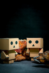 Wooden robot with stones on dark background, artificial intelligence concept
