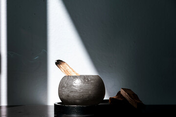 Palo Santo sticks on a light background.Aromatherapy religious rituals meditation.Wellness with...