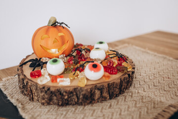 Obraz na płótnie Canvas Autumn Still Life Halloween Pumpkin, Sweets and Spiders