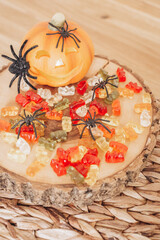 Autumn Still Life Halloween Pumpkin, Sweets and Spiders