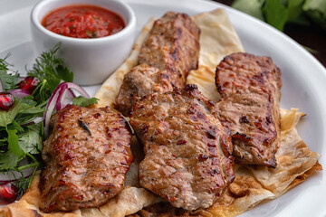 Shish kebabs on a white plate