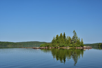 Fototapeta premium La Mauricie National Park Caribou lake. Calm lake with small island