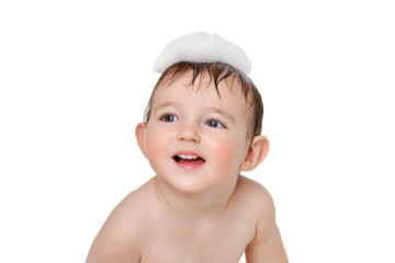 Child sitting in a white tub with soap suds, isolated on a white background. Washes baby head with shampoo, isolated on a white background. Kid aged one year and three months