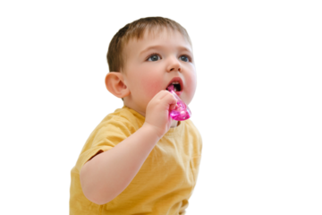 The baby's dental hygiene is being taken care of as she brushes her teeth in the crib, isolated on white background. Kid aged about two years (one year eleven months)