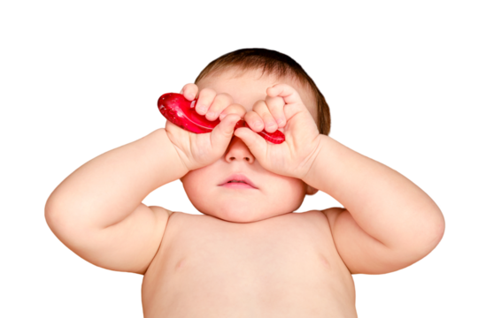 Toddler baby refuses to brush her teeth with a toothbrush, isolated on a white background. A boy child does not want to brush his teeth on his own, isolated on a white background. Kid age one year
