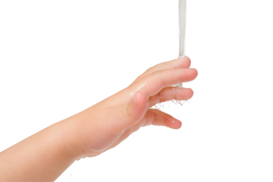 Close up of child's hand washing under running water in the bathroom, isolated on white background. Kid aged two years (two-year-old boy)