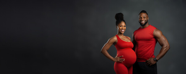 Fototapeta na wymiar banner portrait pregnant african american couple on grey, family man and woman does sport together in red sportswear, black sporty expecting lady , Healthy lifestyle during pregnancy, copyspace.