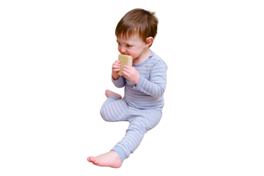 Toddler baby plays with household chemicals and detergent from the closet, isolated on white background. Child boy with detergent bottle in home living room. Kid age one year nine months