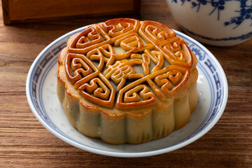 Fresh baked traditional Chinese moon cake stuffed with red bean paste and egg yolk