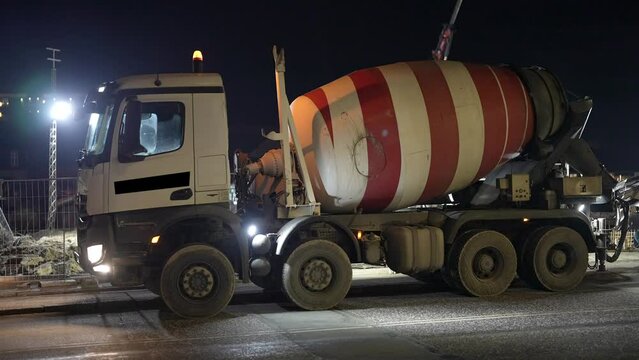 Concrete Mixer Truck, Cement Truck, oncrete mixer truck in front of a concrete batching plant, cement factory. Loading concrete mixer truck. Close-up. Delivery of concrete to the construction site.