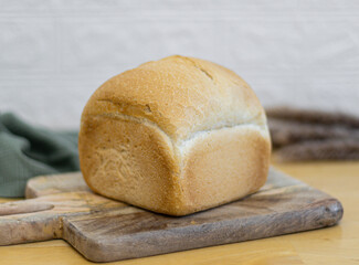 One white square wheat bread on the table.