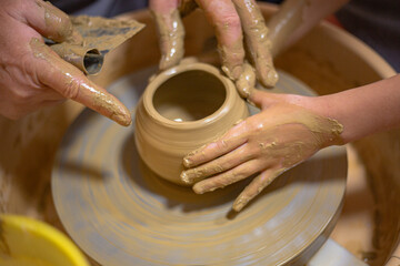 hands of a potter at work