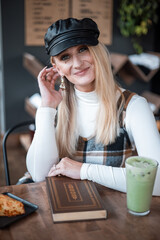 Woman smiling in a coffee shop