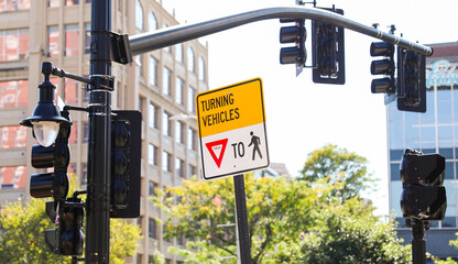 pedestrian sign on urban street corner, symbolizing safety and traffic awareness, with vibrant...