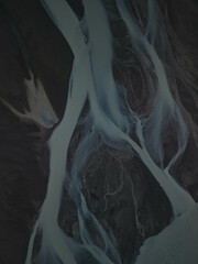 Silhouette of glacial rivers in Iceland from a drone view that look like an aquarelle