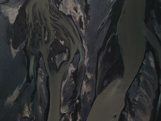 Obraz premium Silhouette of glacial rivers in Iceland from a drone view that look like an aquarelle