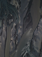 Silhouette of glacial rivers from a drone view in Iceland that look like an aquarelle