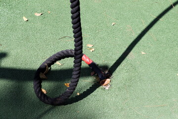 Thick hemp rope on the pier in the seaport.