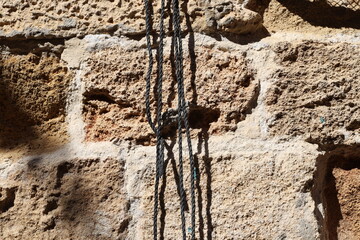Thick hemp rope on the pier in the seaport.