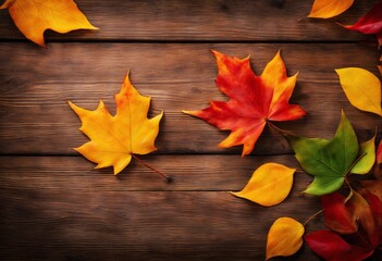 Naklejka na ściany i meble Autumn background with colorful leaves on wooden background