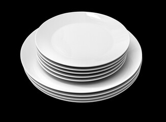 a stack of white plates