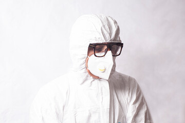 Doctor scientist in white coverall suit, mask and glasses. Dispersal and research of dangerous...