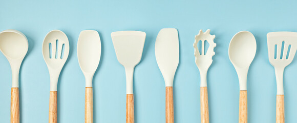 Fototapeta premium Pastel color kitchen utensils top view. Cooking blog, classes, workshop, recipe template concept