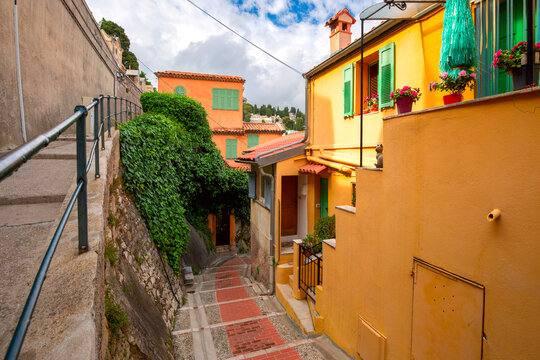 Fototapeta Colorful cosy street and houses in the Old Town of Menton, French Riviera, France