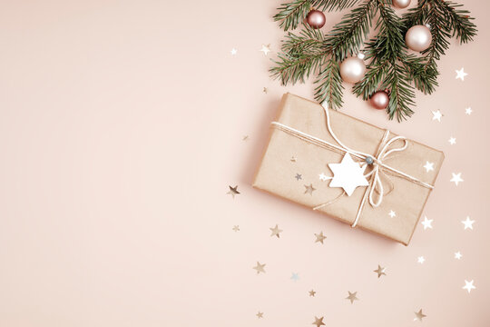 Christmas background with gift box. Xmas celebration, preparation for winter holidays. Festive mockup, top view, flatlay