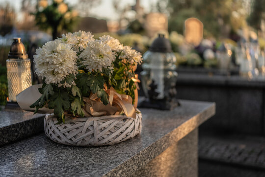 Flowers placed on graves at a cemetery, Poland, November 1 &mdash; All Saints' Day (also known as All Souls' Day / Day of the Dead)