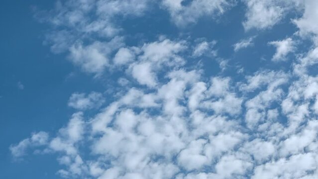 beautiful time lapse footage of a sunny day with blue sky cumulus and cirrus clouds