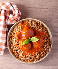 Meatballs in tomato sauce and buckwheat