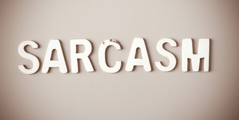  Sarcasm - written with wooden letters