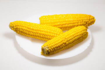 Closeup of corn kernels on plate isolated
