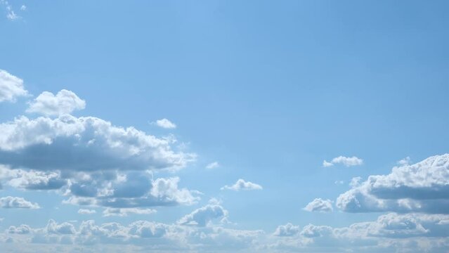 beautiful time lapse footage of a sunny day with blue sky and cumulus clouds
