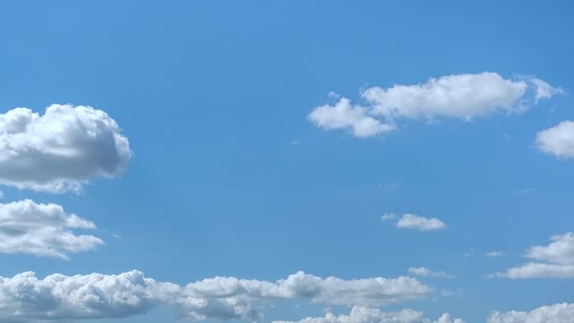 beautiful time lapse footage of a sunny wind day with blue sky and cumulus clouds