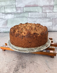 Lighter Spelt Apple Streusel Cake side view on a grey surface.