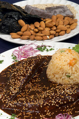 Mole poblano with chicken and sesame seeds, ingredients to make mole poblano, Mexican food