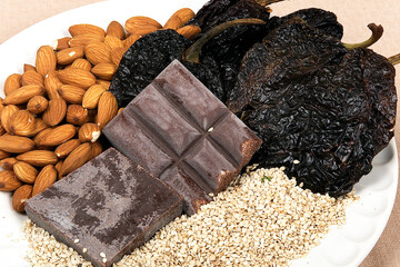 Mole poblano with chicken and sesame seeds, ingredients to make mole poblano, Mexican food