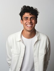 Fototapeta premium Happy european man in casual clothing against a neutral background