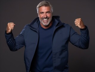 Fototapeta premium Happy european man in casual clothing against a neutral background
