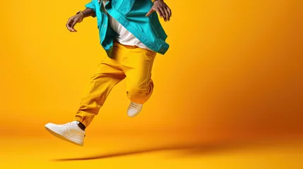 Foto auf Acrylglas Tanzschule Creative modern hip hop dance banner template for adults, cropped image of dancing person on flat yellow background with copy space. 